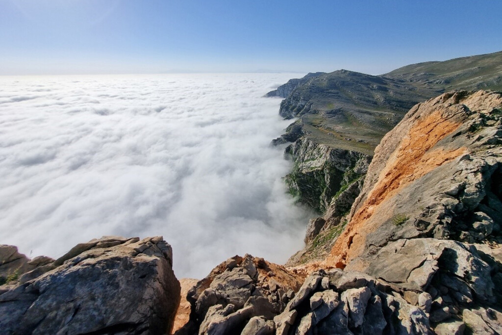 Perfect view of Mountain Peaks among clouds, mountains close to sea Caspian beaches 